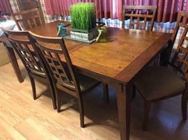 Table with one leave in center and chairs from Ashley Furniture