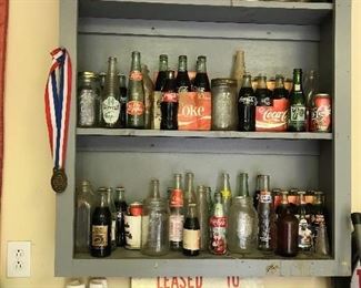 Assortment of old beverage bottles 