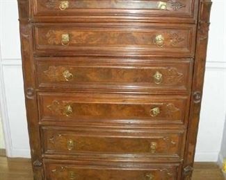 Master Bedroom-First Floor:  This six-drawer antique English "side-lock" chest is also known as a "Wellington dresser."   The right panel is hinged and opens like a door to reveal a lock (see the next photo).  They were named "Wellington Dressers"  after Arthur Wellesley, first duke of Wellington who reportedly had a side-lock chest he carried on his military campaigns.  They are also known as “boarding house dressers” because the side lock could protect the contents from residents of some of the less respectable residences. Some were made in the U.S. but most are of English origin.  This one measures 42" wide x 20" deep x 55" tall.
