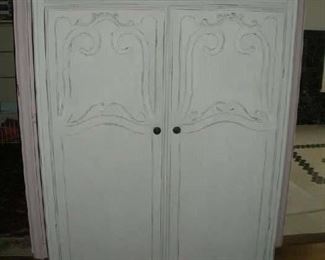 Master Bedroom-First Floor:  A child's size painted chifferobe measures 38: wide x 19" deep x 65" tall.