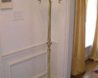 Foyer:  This brass hat/coat hall tree is 5' 7" tall.  Its base depicts lion heads and lion paws.  