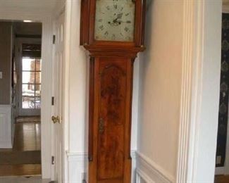 Foyer:  This antique tall case mahogany clock is American, probably late 1700's.  Clockmaker noted is Abel Stowe, Worcester, Massachusetts.  The clock is 8'  3" tall x 21-l/2" wide x 10-l/2 deep.  It is a magnificent antique!  Closer photos follows.  The column bases are fluted with brass decorations.  The pendulum door has a top arch design.
