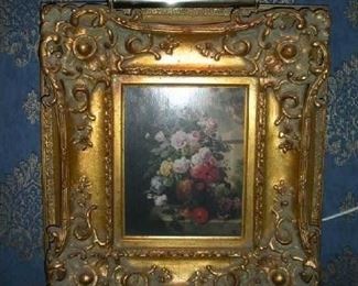 Living Room:  A sweet floral print in carved frame has a total measurement of 17-l/2" x 19-l/2."   The art light is included.  (The painting was originally purchased at BAKER ODDS & ENDS.) 