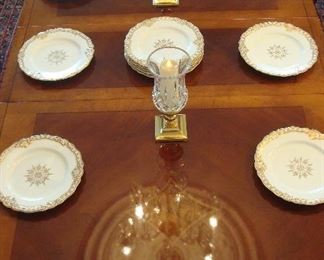 We set the dining room table with some of the Worcester gold and white china to show you its elegant simplicity.  Waterford and brass hurricanes are also displayed.