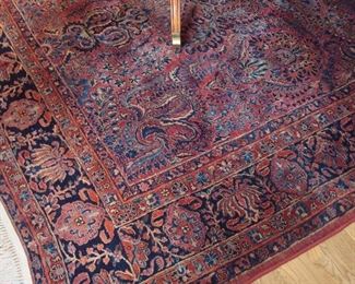 Dining Room:  A classic Oriental rug in red, blue and cream measures 9'  2"  x 12"  6" (including fringe).