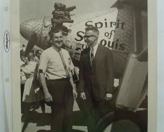 Collectibles-in Kitchen:   Photograph of Sandy McDonnell (right) with McDonnell employee in front
of a "Spirit of St. Louis" replica, dated May 21, 1967.  (This may be the airplane replica that hangs in the St. Louis Airport.) In looking at the employee's badge thru a loop, his name appears to be:  "Terry Clark." 
-Do you know him?  Friend?  Neighbor?  Relative?
