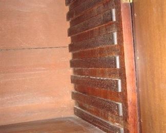 Living Room:  Here you can see the inside of the secretary and how the shelves are adjustable.  Each shelf can pull out and then be inserted to a different height.  This gives you some idea of the age.