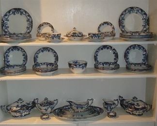 Living Room:  The antique STAFFORDSHIRE Berslum, England flow blue is priced out.  Available are:  dinner plates, salad plates, soup bowls, covered tureens, platters, gravy, cream and sugar, butter pats, cups & saucers. 