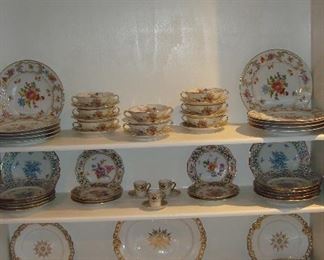 Living Room:  Various dishes are displayed including:  Bavaria Schuman "Forget Me Not;" Theodore Haviland Limoge Floral "Jewel" two-handle soups and under-plates; WORCESTER 
gold & white china; and more.
