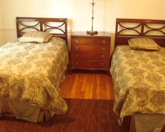 Bedroom #3-Second Floor:  Two matching twin vintage beds are priced separately from the elegant toile linens and mattress sets.  Each bed has a headboard, footboard and side rails.  The pale blue/brown toile twin-size bedding includes duvets, pillows, and coordinating bed skirts.   The petite vintage four-drawer commode in between the beds is perfect for those small areas where you can use some storage space.  This one measures 30" wide x  16" deep x 31" tall. 