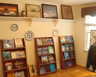 Bedroom #2-Upstairs: Three standing book displays are for sale as are the books in them.  The photos on the shelf, the hanging wall plaques and the rounder of McDonnell Douglas related sweaters, jackets and Polo shirts are all priced for you!  The closet across the room (not shown) has numerous McDonnell Douglas caps, mugs, glasses, and other related items.
