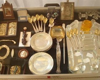 Collectibles-in Kitchen: One of the two cases displays collectibles and sterling, as well as glass knife rests  and other items.  Some closer photos are coming up.