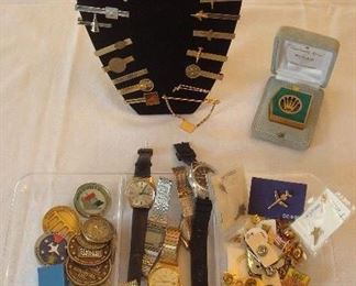 Collectibles/Kitchen:  Aircraft related items include tokens, tie bars and tie pins.  In the middle section is a collection of watches.  