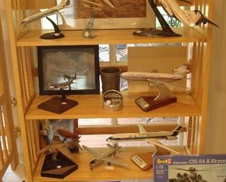 Collectibles in Kitchen:  DC-9 Series 50; Small Bi-Plane on Clear Green Stand; Air Force One Independence/A Douglas DC-6 Liftmaster (VC-118)-Served numerous presidents starting with Truman in 1947; DC-9-30/Series; DC-10-Series 30; a Presentation Piece:  sterling silver HARRIER From British Aerospace to McDonnell to make a new plane in Harrier V/STOL YAV-8B, First flight November 1978; small silver plane with
star on one wing; DC-9-80/Super 80; Wind Tunnel
-Model of Variable Stability Jet Fighter-Circa 1973; and a Piasecki ZV-8P/given by Fred Piiasecki to Randy McDonnell; and a McDonnell first flying catapult (Modified CH-54A Sky-crane) with cargo box and small cannon that goes in the cargo box.