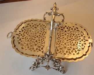 Collectibles/Kitchen:  The silver-plate bun warmer is now open to show the inside grill which keeps the rolls in place.