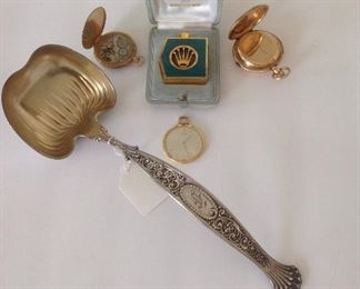 Collectibles-Kitchen:  A vintage 1960s-1970s "Perpetually Yours" perfume bottle by Rolex and Swissair is in its original case.  Also shown are three watches.  The one on the left is a 1920's Deco 14K gold "TURLER" open face pocket (OFP) watch (complete movement) with Arabic numbers.  The one on the right is quite RARE.  It is an antique 14K gold "E. MATHEY" hunter case #26679[chronograph] Minute Repeater pocket watch with a clear glass inside bezel that covers the mechanics.  When a slide lever is slid on the watch case, the timepiece rings out the time through a series of chimes. A minute repeater strikes out the hour, quarter hour, and minutes.  Such a watch may have been used by a gentleman who wanted to discreetly know the time without pulling his watch out of his pocket; or when it was dark, one could "hear" the time; or perhaps a blind person used it.  The Mathey is inscribed: "L.W Cherry, Little Rock, Ark, Feb. 16, 1907." The middle watch is 18K gold from the 1920's and is a "Ja