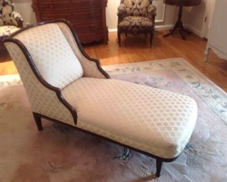 Master Bedroom-First Floor:  A vintage chaise lounge is upholstered in a neutral creamy gold fabric.  The chaise measures 53" long with a 34" tall back.  The wood fame is mahogany.  The pastel color Chinese carved rug measures 8'  1"  x  10'  10."