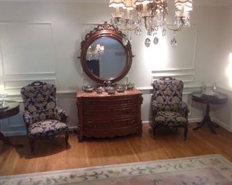Master Bedroom-First Floor:  This is an overview of one side of the master bedroom.    Two drum tables are in the corners and a pair of antique chairs flank the Victorian dresser.  Some closer photos are coming up!