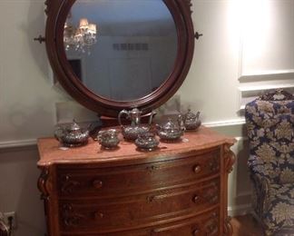 Master Bedroom-First Floor:  This three-drawer antique chest with red marble top has a detached mirror.  The dresser alone measures  47" wide x 23" deep x 33" tall, while the mirror measures  49" tall x 43" wide with a 9" wide base.   The antique  quadruple-plate is monogrammed and priced individually.
