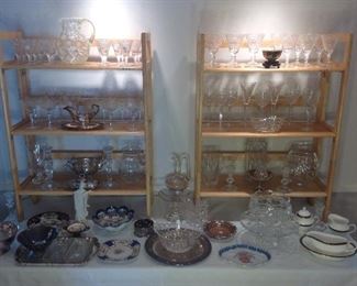 Master Bedroom-First Floor:  Crystal stemware, porcelain plates, silver-plate, WATERFORD "Ashworth" gravy, oval dish and cream and sugar; and WATERFORD "Overture" pattern stems, vases and bowls are all displayed.  