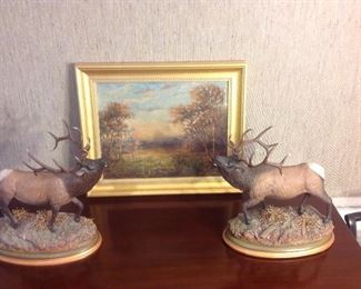 Family Room:  Two signed elk figures are part of the WILDLIFE COLLECTION by artist Frank Dougherty.  The sculptures are metal on a ceramic  base with real dry flowers imitating bushes.  Each one is 15" tall; the oval base measures 8" X 15" to top of horns. They are priced individually. The painting is an original landscape by Ben Brontly.