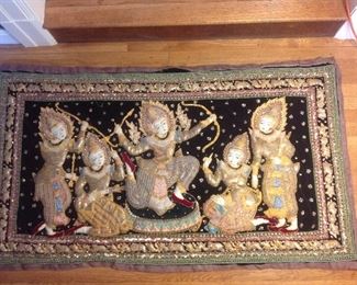 Dining Room:  This beautiful vintage Thai Burmese "Kalagna" wall hanging was elaborately hand embroidered. The rich intricate thread work shimmers with hundreds of tiny sequins and metal beads, as well as the tiny metallic threads interwoven with cotton threads. It has a velvet background  The Burmese figures are each elaborately designed and stuffed for a three-dimensional effect.  It measures 5' wide x 33-l/2" tall.