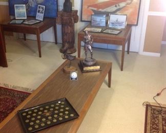 Bedroom #1-Upstairs:  Two mid-century end tables and a coffee table are all priced separately.  The large paintings are better shown in the next photo.  On the coffee table are:  a coin tray from the "International Monetary Conference June 16-19, 1976, San Francisco;" a 15" tall American Eagle by Jonathan Bronson; a 22" tall Eagle Scout statue given to Randy McDonnell in 2012 was originally done by R. t. McKenzie, 1915, but this is a replica;  and a Boy Scouts of America baseball (2014) is in a plastic case.