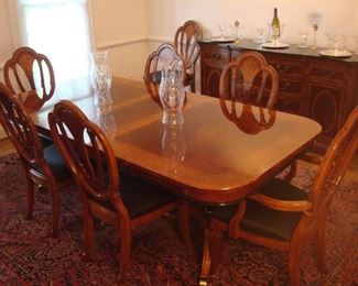 Dining Room:  The elegant banded table with "inlaid" diamond patterns measures 72" X 44" and includes two skirted 15" leaves and custom magnetic pads.  The eight chairs (two arm and six side) are priced with the table.  A closer photo of one of the chairs is coming up.
