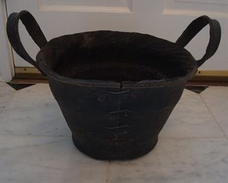Collectibles-Kitchen:  This "bucket" is made of a tire (perhaps an airplane tire?).  The treads and wording can be seen on the inside.  Whoever would have thought!