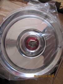 4 hubcaps from 1954 Ford
