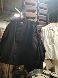 Assorted new and used black or white chef jackets