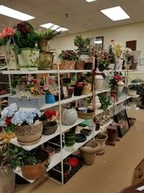 Assorted floral arrangements vases and flower pots