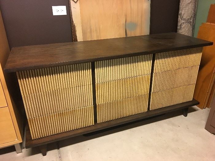 American of Martinsville mid-century Asian 9-drawer dresser. The drawer fronts are original, the balance stained in a dark walnut color. Also included - the rectangular mirror with dark walnut stained frame.