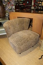 Pair of 1950s slipper chairs professionally upholstered in a soft leopard print fabric, legs have been black lacquered