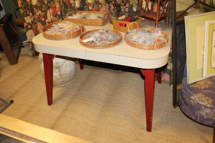Mid-century modern dinette table with dark orangish red painted legs