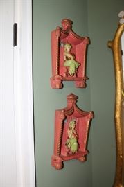 Pair of chalkware plaques with genie motif