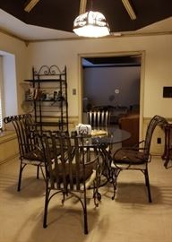 Casual dining - glass top table with heavy iron chairs