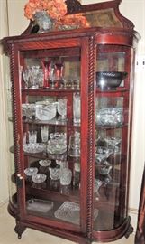 Bow front cabinet with mirror