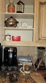 Pyrex orange juice, coffee press, Tassimo coffee maker, blender and Penguin ice bucket