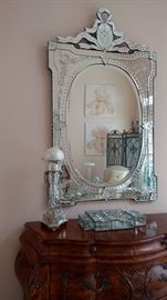 One of a pair of matching Venetian mirrors. They are each 56"h x 33"w.