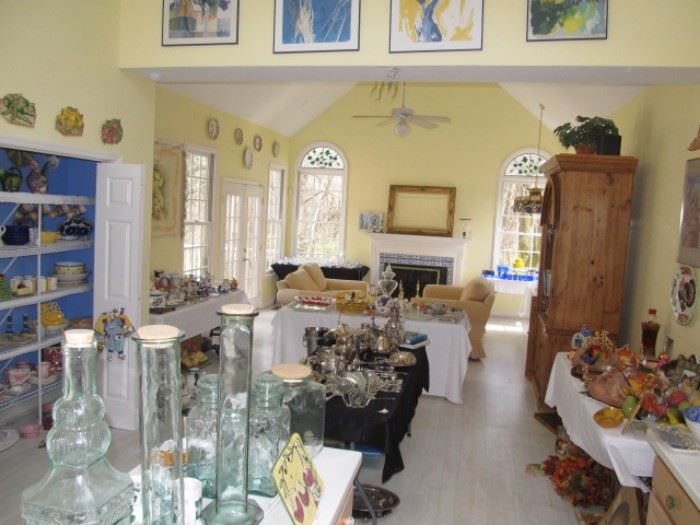 View of Great room with ceramics, glassware, silver plate, furniture.