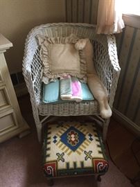 Wicker Chair and Needlepoint Stool.