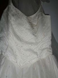 DETAIL OF BODICE OF WEDDING DRESS