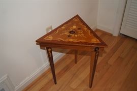 triangular table with opening top also music box.