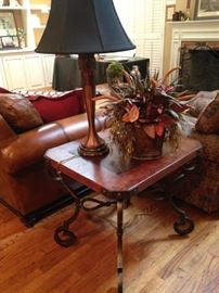 This handsome side table goes so well with the coffee table and is accented by one of two matching black-shaded lamps.