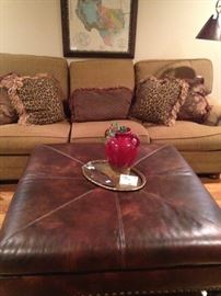 Four feet x  four feet leather ottoman/coffee table; decorative pillows