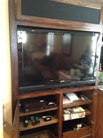 Large flat screen TV and entertainment center