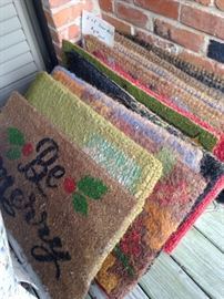 An array of seasonal door mats