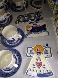 Blue & white cups & saucers; J. Duban Design wall hangings
