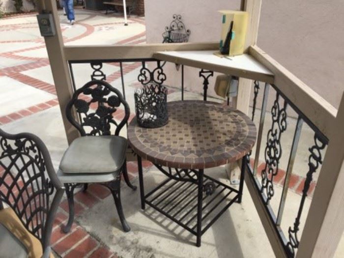 In this photo, a patio side-table and chair.